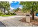 Charming house showcasing a three-car garage and well-kept landscaping on a sunny street at 15027 N 61St Pl, Scottsdale, AZ 85254