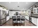 Well lit kitchen with white cabinetry, stainless appliances and a large island at 15027 N 61St Pl, Scottsdale, AZ 85254