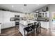 Spacious kitchen featuring a large island, stainless steel appliances and dark countertops at 15027 N 61St Pl, Scottsdale, AZ 85254