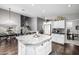 Modern kitchen with island and breakfast bar with a dining table and stairs nearby at 15027 N 61St Pl, Scottsdale, AZ 85254