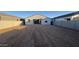 Large backyard showcasing a freshly graded lot enclosed by block fencing offering privacy and space at 15784 W Beryl Ave, Waddell, AZ 85355