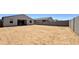 Spacious backyard area with block wall fencing offering privacy, ready for landscaping at 15784 W Beryl Ave, Waddell, AZ 85355