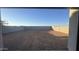 Expansive backyard featuring a block fence for privacy, awaiting your personal landscaping touch at 15784 W Beryl Ave, Waddell, AZ 85355