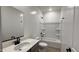 Clean bathroom featuring a modern vanity, a tub with shower, and sleek fixtures at 15784 W Beryl Ave, Waddell, AZ 85355