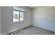 Cozy bedroom with neutral carpet, a window with blinds, and ample natural light at 15784 W Beryl Ave, Waddell, AZ 85355