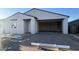 View of the home's exterior showing the driveway and an attached two car garage at 15784 W Beryl Ave, Waddell, AZ 85355