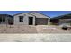 Charming single-story home featuring a stucco facade, landscaped front yard, and a two-car garage at 15784 W Beryl Ave, Waddell, AZ 85355
