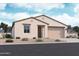 Inviting single-story home featuring a neutral color palette, a two-car garage, and a well-manicured, drought-resistant landscape at 15784 W Beryl Ave, Waddell, AZ 85355
