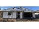 Exterior view of a home under construction, featuring scaffolding and thermal insulation at 15784 W Beryl Ave, Waddell, AZ 85355