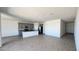 Spacious open-concept layout with a kitchen island and hardwood-style flooring throughout at 15784 W Beryl Ave, Waddell, AZ 85355