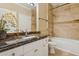 An elegant bathroom features granite counters, a shower and a garden tub at 1701 E Colter St # 311, Phoenix, AZ 85016