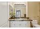 Bathroom features granite countertops, white cabinets, stylish light fixtures, and neutral wall color at 1701 E Colter St # 311, Phoenix, AZ 85016