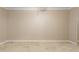 A neutral bedroom with tile floor featuring natural lighting from a sliding door at 1701 E Colter St # 311, Phoenix, AZ 85016