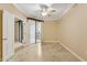 Bedroom with ceiling fan, tile floors and balcony access at 1701 E Colter St # 311, Phoenix, AZ 85016