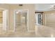 Light filled bedroom with access to a bathroom and access to a balcony at 1701 E Colter St # 311, Phoenix, AZ 85016