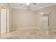 Bright bedroom with ceiling fan, tile floors, view to closet and ensuite bathroom at 1701 E Colter St # 311, Phoenix, AZ 85016