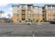 Contemporary condo building featuring assigned parking and balconies on several units at 1701 E Colter St # 311, Phoenix, AZ 85016
