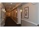 Well-lit hallway with neutral paint, crown molding, and decorative sconces provides a welcoming atmosphere at 1701 E Colter St # 311, Phoenix, AZ 85016