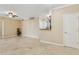 An open-concept living room with neutral walls offers seamless access to dining and kitchen at 1701 E Colter St # 311, Phoenix, AZ 85016