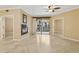 Bright living room with fireplace, ceiling fan, and sliding doors to a balcony at 1701 E Colter St # 311, Phoenix, AZ 85016