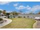 Spacious backyard featuring lush green grass and a beautiful in-ground pool at 18360 N 169Th Ave, Surprise, AZ 85374