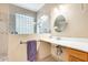 Bathroom showcasing accessible sink, glass block window, and tiled walk-in shower at 18360 N 169Th Ave, Surprise, AZ 85374