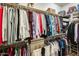 Spacious walk-in closet features tiered hanging rods and shelving at 18360 N 169Th Ave, Surprise, AZ 85374