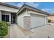Charming home with a two-car garage and a stone accent wall at 18360 N 169Th Ave, Surprise, AZ 85374