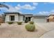 Charming single-story home featuring a well-maintained yard and a two-car garage at 18360 N 169Th Ave, Surprise, AZ 85374