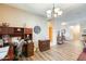Cozy home office space with wood floors, a desk, and a chandelier at 18360 N 169Th Ave, Surprise, AZ 85374