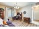 Inviting home office featuring wood floors, a desk, and a chandelier at 18360 N 169Th Ave, Surprise, AZ 85374