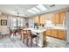 Bright kitchen featuring an island, natural wood cabinets, and a dining area with large windows at 18360 N 169Th Ave, Surprise, AZ 85374