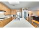 Stylish kitchen with a breakfast bar, stainless steel appliances, and a view into the living area at 18360 N 169Th Ave, Surprise, AZ 85374