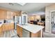 Modern kitchen featuring a large island, stainless steel appliances, and wood flooring at 18360 N 169Th Ave, Surprise, AZ 85374
