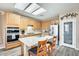 Well-lit kitchen with a large island, stainless steel appliances, and a double oven at 18360 N 169Th Ave, Surprise, AZ 85374
