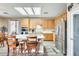 Inviting kitchen with an island, modern appliances, and wood flooring, with an adjacent dining space at 18360 N 169Th Ave, Surprise, AZ 85374