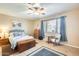 Cozy main bedroom featuring a ceiling fan, comfortable bed, and stylish furnishings for a relaxing retreat at 18360 N 169Th Ave, Surprise, AZ 85374