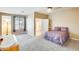 Spacious main bedroom with neutral carpet and an attached bathroom at 18360 N 169Th Ave, Surprise, AZ 85374