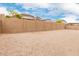 Unfinished backyard with block wall in need of landscaping or other upgrades at 18988 W Cortez St, Surprise, AZ 85388