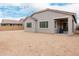 Exterior of home featuring an unfinished backyard in need of landscaping or other upgrades at 18988 W Cortez St, Surprise, AZ 85388