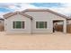 Exterior of home featuring an unfinished backyard in need of landscaping or other upgrades at 18988 W Cortez St, Surprise, AZ 85388