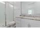 Bright bathroom with a granite countertop, and glass-enclosed shower at 18988 W Cortez St, Surprise, AZ 85388