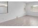Bright bedroom featuring neutral walls, light floors, and natural light from multiple windows at 18988 W Cortez St, Surprise, AZ 85388