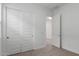 Well-lit bedroom with carpet, white trim, and a door with a closet at 18988 W Cortez St, Surprise, AZ 85388