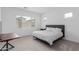 Bright bedroom featuring a neutral color palette, large window and carpeted floors at 18988 W Cortez St, Surprise, AZ 85388