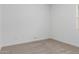 Bright bedroom featuring neutral carpet, crisp white walls, and natural light at 18988 W Cortez St, Surprise, AZ 85388
