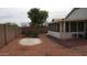 Secluded backyard featuring low-maintenance landscaping, block wall, and partial view of the sunroom at 20479 N 105Th Ave, Peoria, AZ 85382