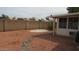 Spacious backyard with desert landscaping, a block wall for privacy and a sunroom in the distance at 20479 N 105Th Ave, Peoria, AZ 85382