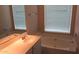 Bright bathroom featuring a tub, large window and a stylish vanity sink at 20479 N 105Th Ave, Peoria, AZ 85382