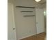 A bedroom with plank flooring and built-in shelves at 20479 N 105Th Ave, Peoria, AZ 85382